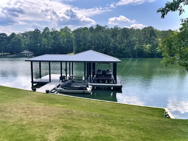 Boathouse and dock with PWC ports
