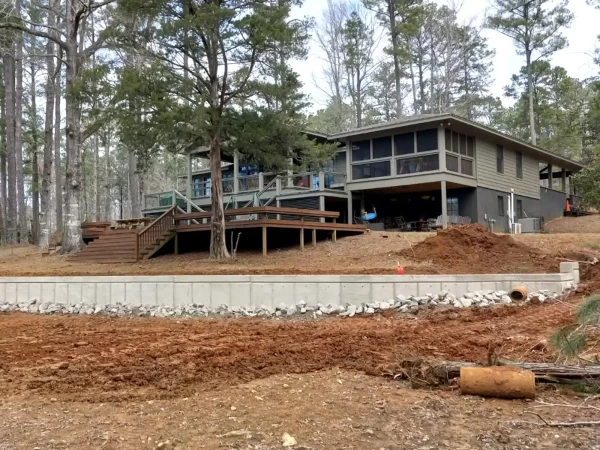 Seawall with house in background