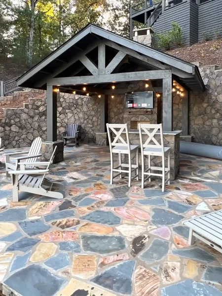 Patio with covered area and built-in fireplace